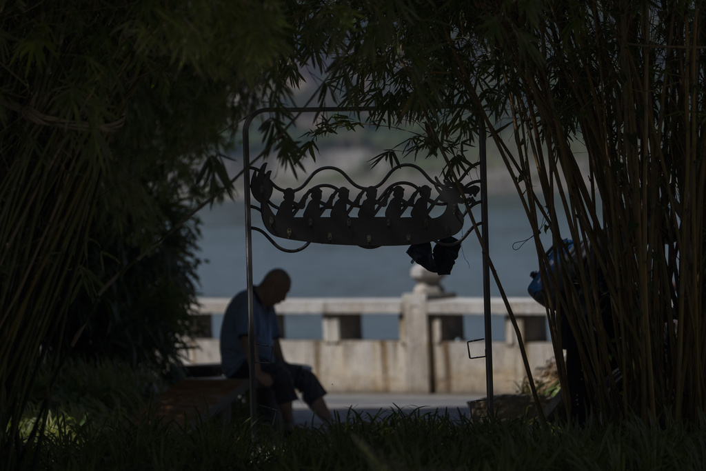A sculpture depicting dragon boat rowers is seen along the banks of the Yangtze River near Yichang in central China's Hubei province on June 16, 2025. (AP Photo/Ng Han Guan)