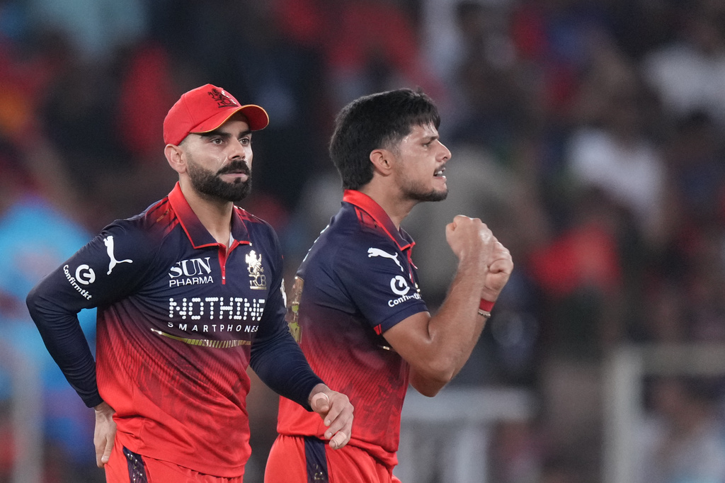 Royal Challengers Bengaluru's Rasikh Dar celebrates the wicket of Gujarat Titans' Nishant Sindhu during the Indian Premier League final cricket match between Gujarat Titans and Royal Challengers Bengaluru in Ahmedabad, India, Sunday, May 31, 2026. (AP Photo/Ajit Solanki)