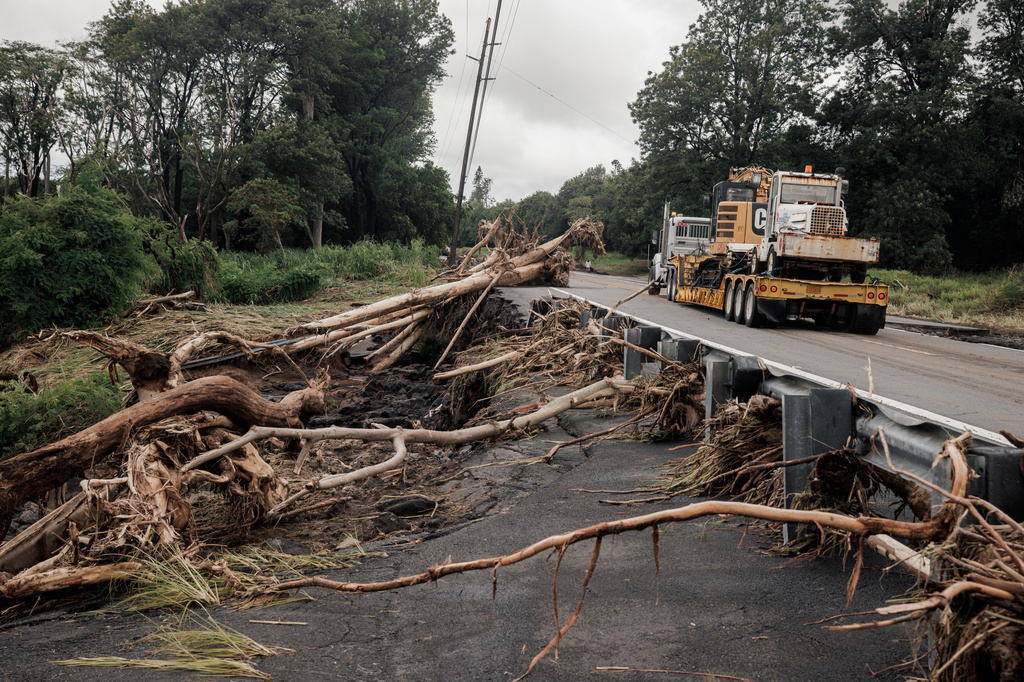 Debris is seen along Hawaiʻi Belt Road near Pahala, Hawaii, Sunday, Aug. 16, 2026, after a severe weather system went through the area. (Stephen Lam/San Francisco Chronicle via AP)
