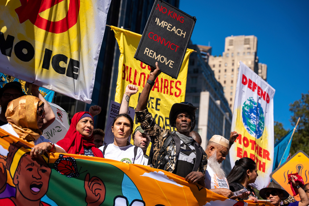 FILE - Protestors march through Manhattan up to Central Park during the "Make Billionaires Pay" climate protest, Sept. 20, 2025, in New York. (AP Photo/Angelina Katsanis, File)