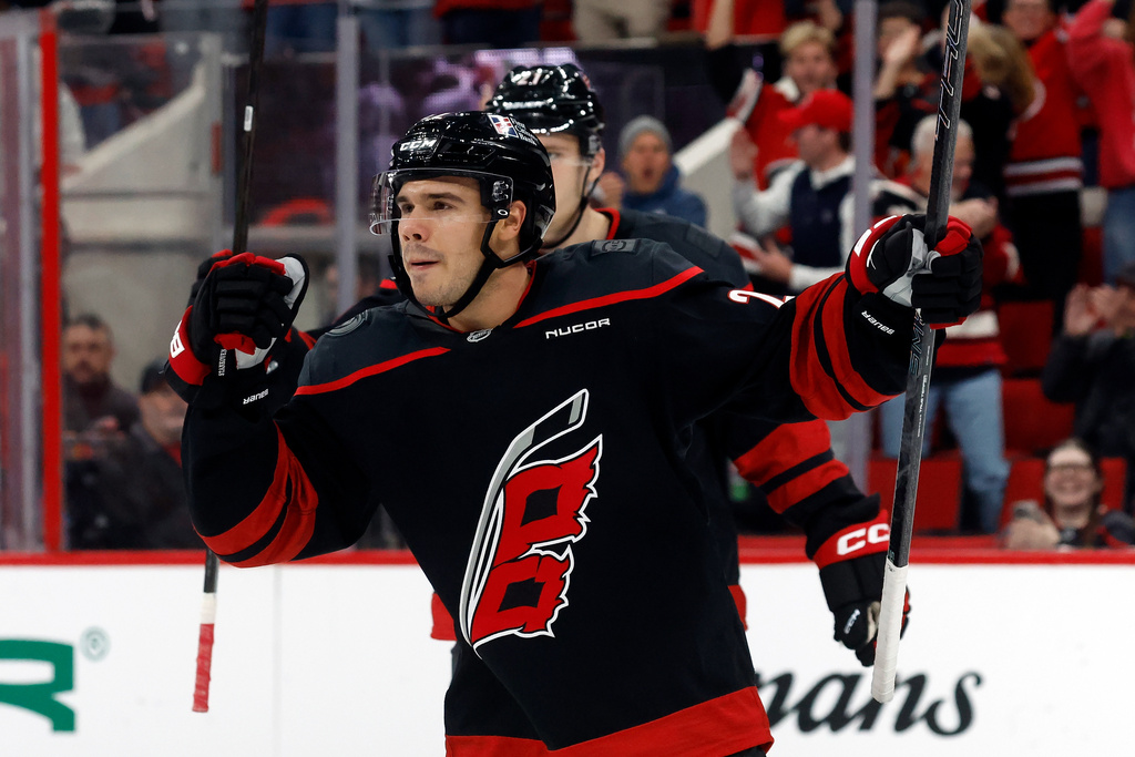 Carolina Hurricanes' Logan Stankoven (22) celebrates his goal against the Philadelphia Flyers during the second period of an NHL hockey game in Raleigh, N.C., Saturday, Oct. 11, 2025. (AP Photo/Karl DeBlaker)