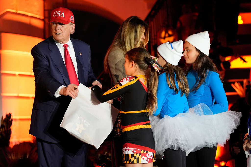 President Donald Trump and first lady Melania Trump participate in a Halloween at the White House event on the South Lawn, Thursday, Oct. 30, 2025, in Washington. (AP Photo/Alex Brandon)