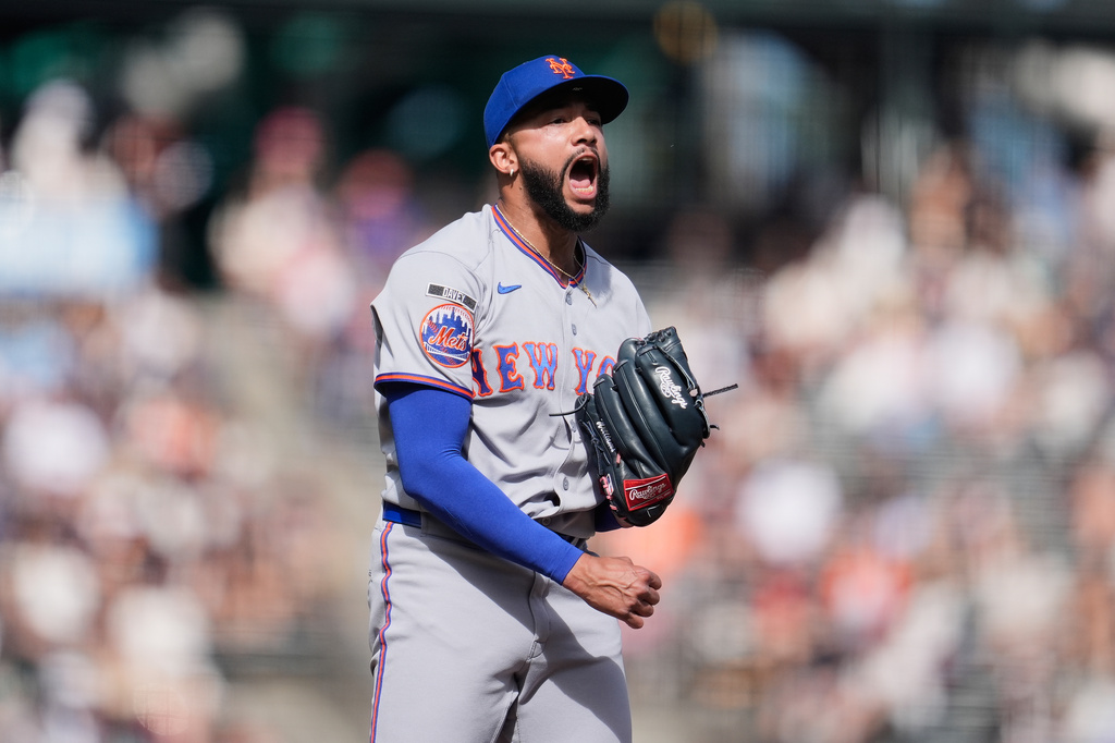 New York Mets pitcher Devin Williams celebrates after striking out San Francisco Giants' Jung Hoo Lee during the ninth inning of a baseball game in San Francisco, Sunday, April 5, 2026. (AP Photo/Jeff Chiu)