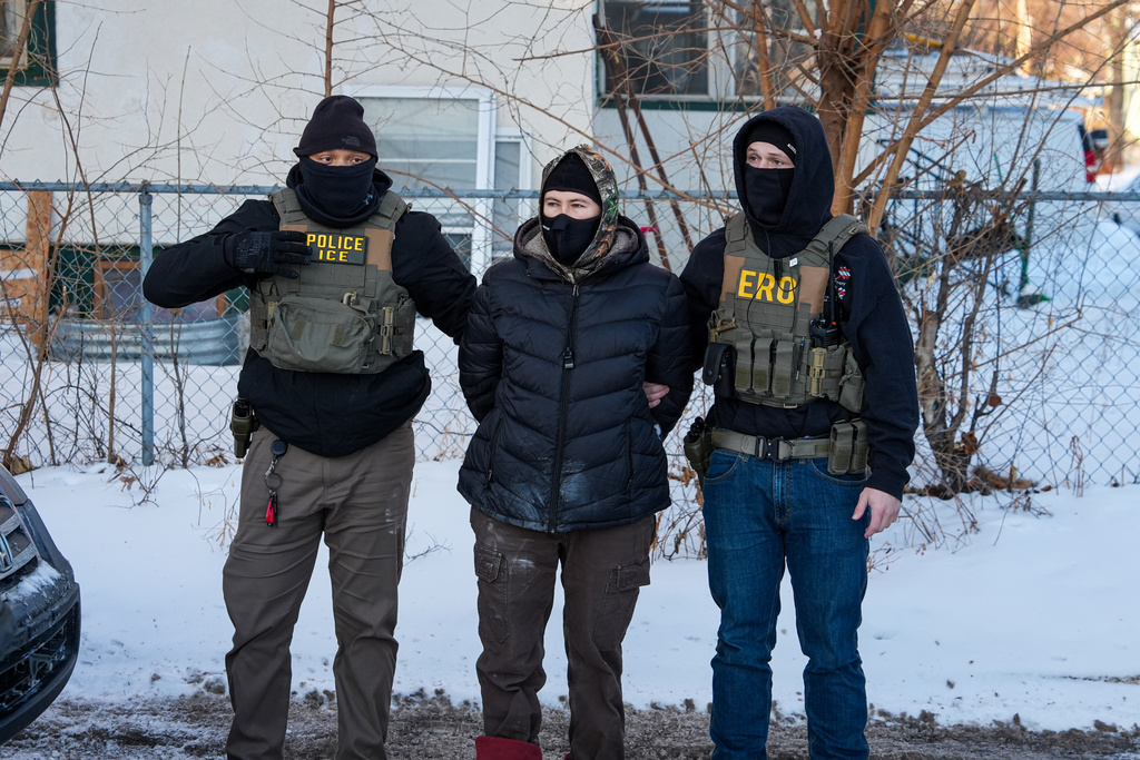 An activist is detained by federal agents on Tuesday, Feb. 3, 2026, in Minneapolis. (AP Photo/Ryan Murphy)