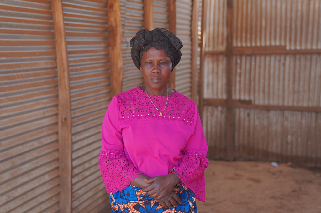 Ana Ndroy Kasime, a community health worker in Nizi, speaks during an interview as she visits homes to educate residents about Ebola and reports suspected cases to health officials in Nizi, Ituri province, eastern Congo, Friday, Aug. 14, 2026. (AP Photo/Dieudonne Dirole)