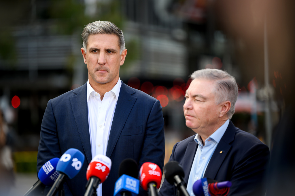 Sydney Swans Australian Rules Football club CEO Matthew Pavlich, left, and Chairman Andrew Pridham speak to the media in Sydney, Wednesday, Aug. 19, 2026. (Bianca De Marchi/AAP Image via AP)
