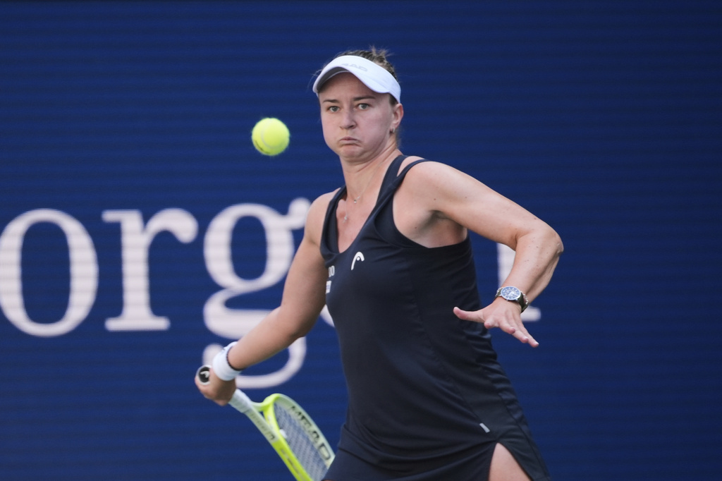 Barbora Krejcikova, of the Czech Republic, returns a shot against Taylor Townsend, of the United States, during the fourth round of the U.S. Open tennis championships, Sunday, Aug. 31, 2025, in New York. (AP Photo/Pamela Smith)