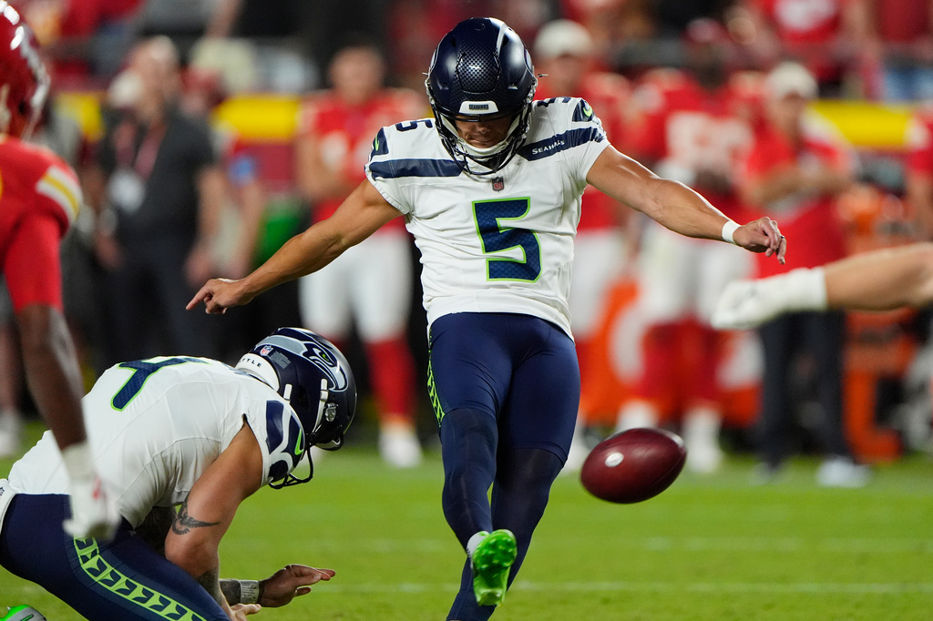 Seattle Seahawks kicker Jason Myers (5) misses a field goal attempt as Seahawks holder Michael Dickson (4) holds his position during the second half of a preseason NFL football game against the Kansas City Chiefs, Friday, Aug. 28, 2026, in Kansas City, Mo. (AP Photo/Charlie Riedel)