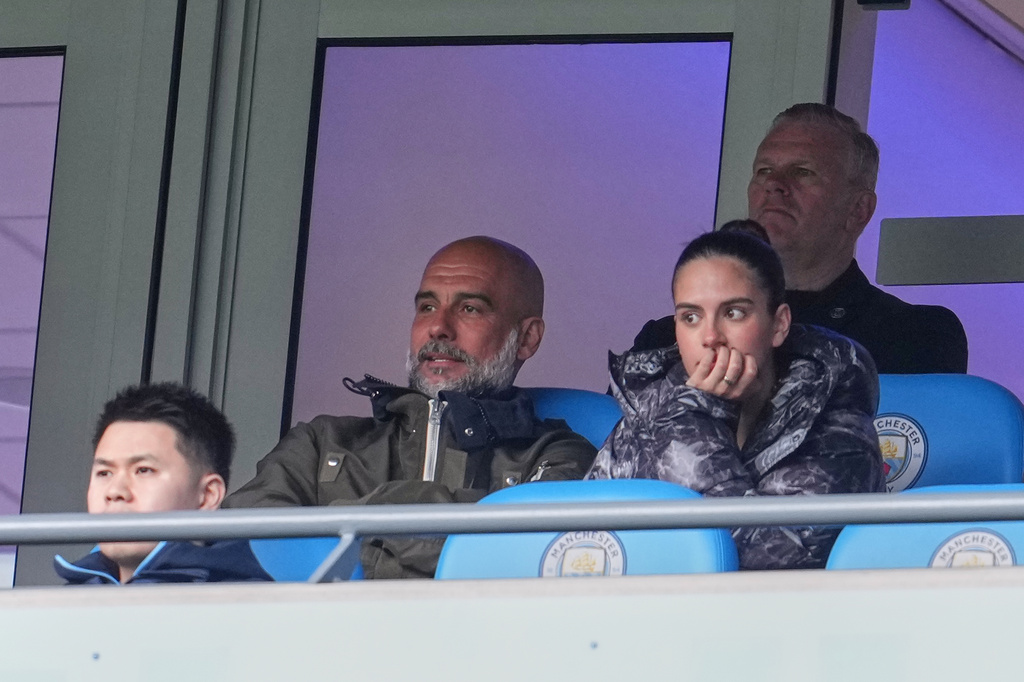 Manchester City's head coach Pep Guardiola watchs from the stand during the FA Cup quarter-final soccer match between Manchester City and Liverpool in Manchester, England, Saturday, April 4, 2026. (AP Photo/Jon Super)
