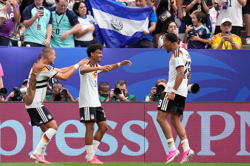 Germany's Nathaniel Brown celebrates with Felix Nmecha, right, after scoring his side's fifth goal during the World Cup Group E soccer match between Germany and Curacao in Houston, Sunday, June 14, 2026. (AP Photo/Karen Warren)