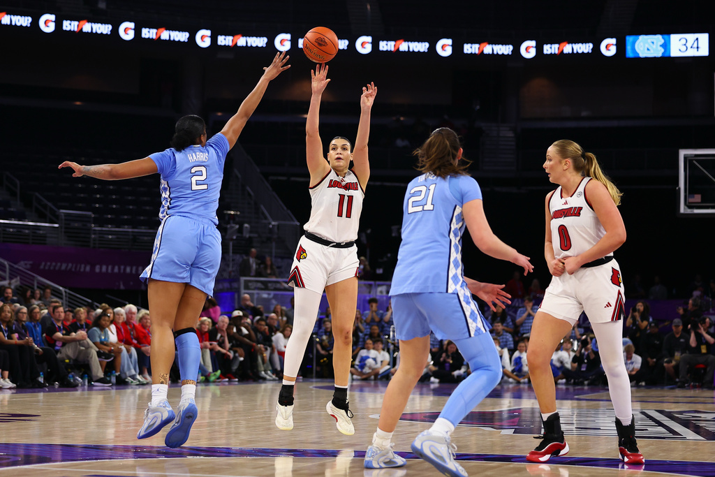 Louisville forward Elif Istanbulluoglu (11) shoots against North Carolina forward Nyla Harris (2) during the second half of an NCAA college basketball game in the semifinals of the Atlantic Coast Conference tournament, Saturday, March 7, 2026, in Duluth, Ga. (AP Photo/Colin Hubbard)