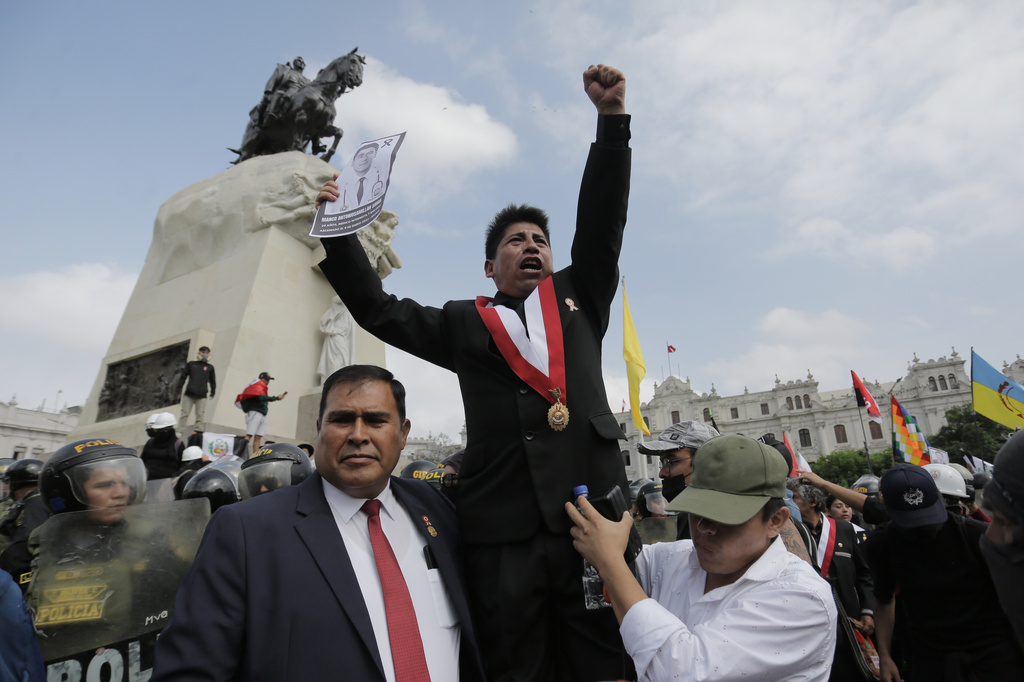 Jesus Perez, of the opposition Together for Peru, party joins opponents of new President Keiko Fujimori during a protest on the day of her inauguration in Lima, Peru, Tuesday, July 28, 2026. (AP Photo/Gerardo Marin)