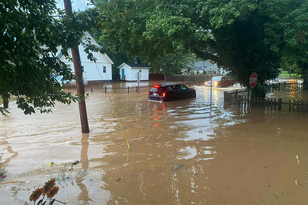 This photo provided by Joe Kinzer shows flash flooding Tuesday, July 21, 2026, in Buckhannon, W.Va. (Joe Kinzer via AP)