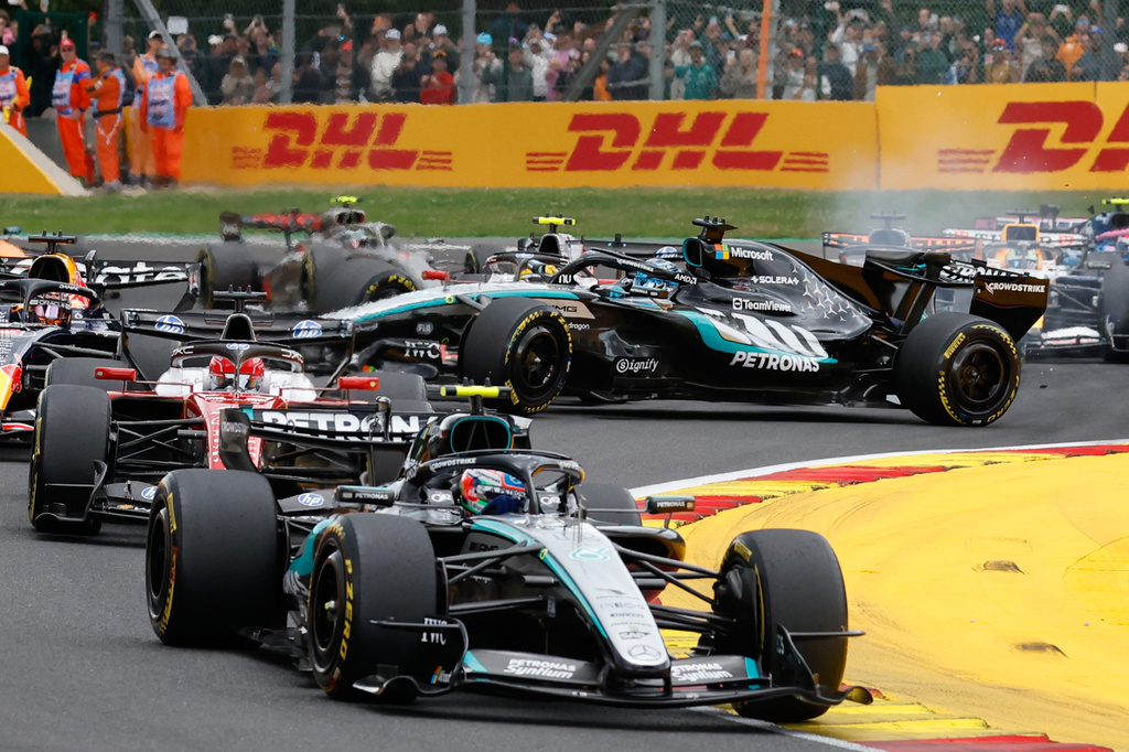 Mercedes driver George Russell of Britain, center, spins on the track during the Formula One Grand Prix at the Spa-Francorchamps racetrack in Spa, Belgium, Sunday, July 19, 2026. (AP Photo/Geert Vanden Wijngaert)