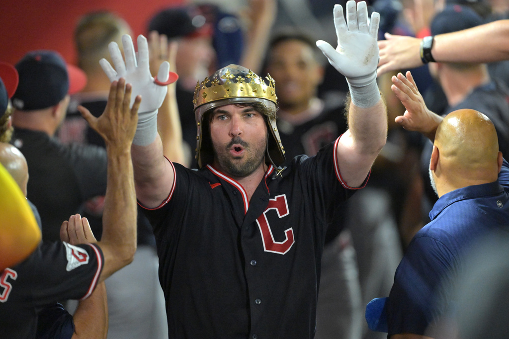 Cleveland Guardians' Austin Hedges is congratulated in the dugout after hitting a two-run home run during the sixth inning of a baseball game against the Los Angeles Angels, Monday, Aug. 24, 2026, in Anaheim, Calif. (AP Photo/Jayne Kamin-Oncea)