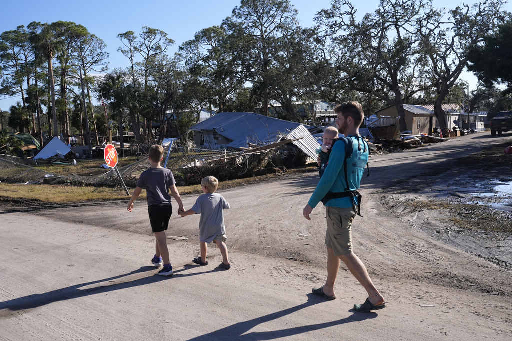 Supplies, emergency workers rushed to North Carolina while Florida digs