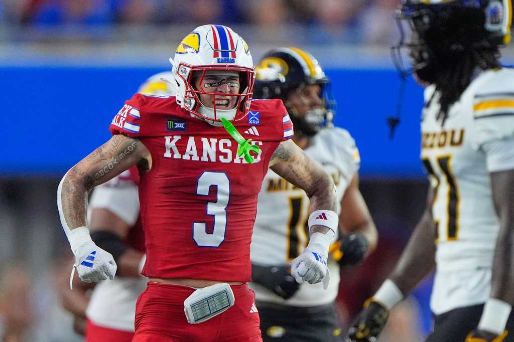 Kansas wide receiver Keaton Kubecka (3) celebrates after catching a pass for a first down during the first half of an NCAA college football game against Missouri, Friday, Sept. 11, 2026, in Lawrence, Kan. (AP Photo/Charlie Riedel)