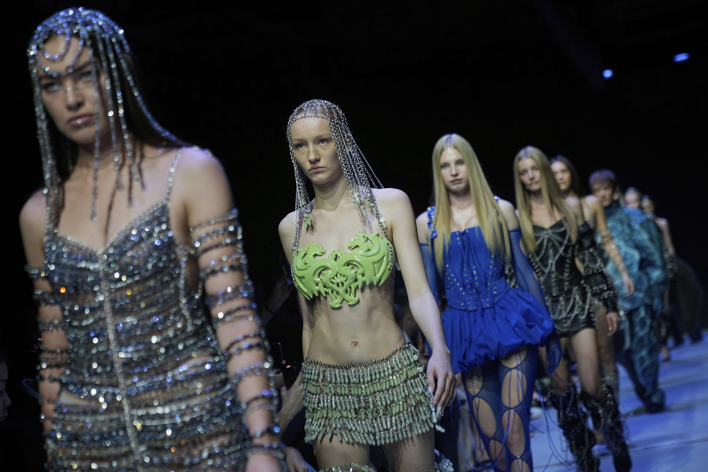 Models wear creations by Brazilian brand Artemisi on a runway at the Moscow Fashion Week in Moscow, Russia, Friday, Aug. 29, 2025. (AP Photo/Pavel Bednyakov)