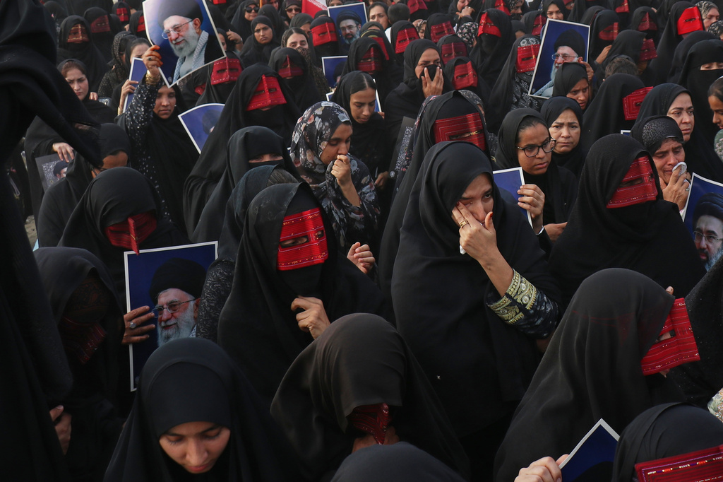 Women attend a mass funeral procession for people killed when, according to Iranian media and a rights group, a U.S. missile struck a home where a wedding was being held in Kuhestak, southern Iran, Thursday, Sept. 3, 2026. (Razieh Poudat/ISNA via AP)