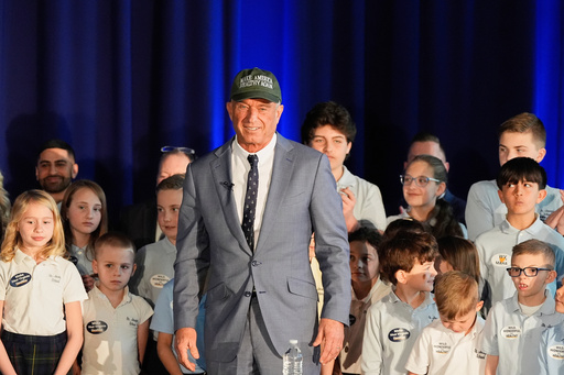 FILE - Health and Human Services Secretary Robert F. Kennedy Jr. stands among students during an event announcing proposed changes to SNAP and food dye legislation, Friday, March 28, 2025, in Martinsburg, W. Va. (AP Photo/Stephanie Scarbrough, File) FILE - Health and Human Services Secretary Robert F. Kennedy Jr. stands among students during an event announcing proposed changes to SNAP and food dye legislation, Friday, March 28, 2025, in Martinsburg, W. Va. (AP Photo/Stephanie Scarbrough, File)