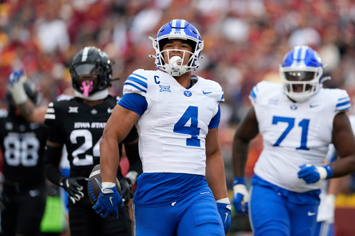 BYU running back LJ Martin (4) runs in a touchdown against Iowa State during the first half of an NCAA college football game, Saturday, Oct. 25, 2025, in Ames, Iowa. (AP Photo/Matthew Putney) BYU running back LJ Martin (4) runs in a touchdown against Iowa State during the first half of an NCAA college football game, Saturday, Oct. 25, 2025, in Ames, Iowa. (AP Photo/Matthew Putney)