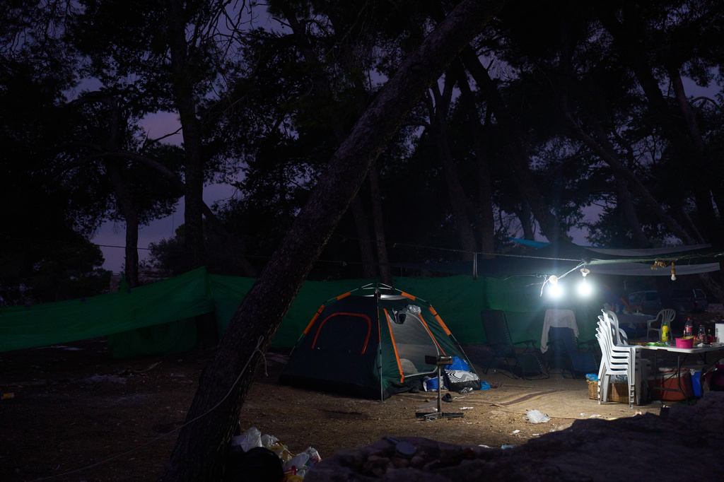 Tents of Christian pilgrims who spent overnight in the forest next to the Basilica of the Transfiguration on Mount Tabor, northern Israel, on Aug. 6, 2026. (AP Photo/Ariel Schalit)