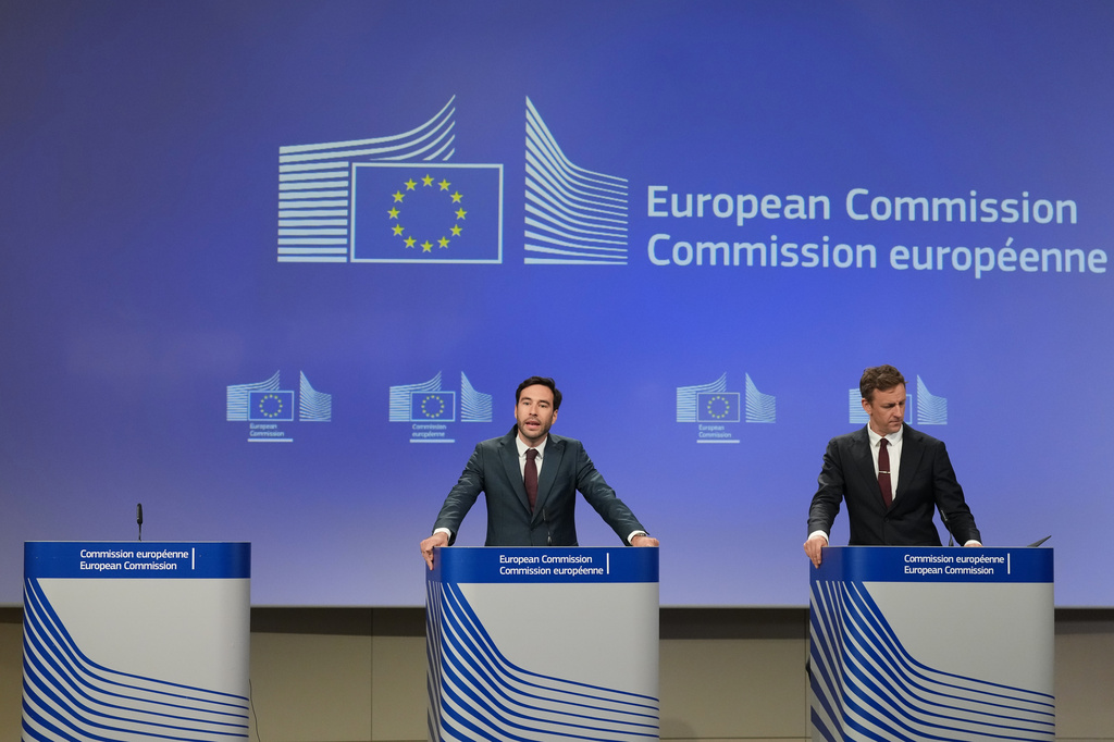 European Commission spokesman Thomas Regnier, left, speaks during a media conference regarding a fine against Google at EU headquarters in Brussels, Thursday, July 23, 2026. (AP Photo/Virginia Mayo)