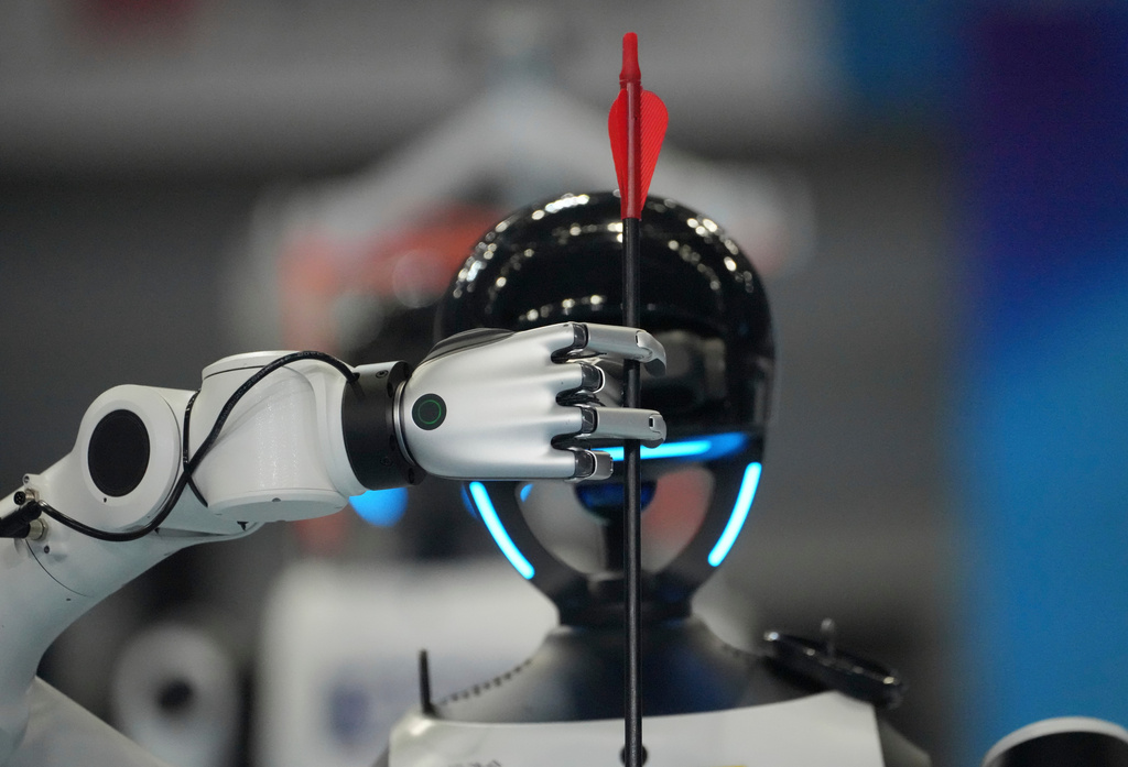 A humanoid robot competes in the pitch pot legged group final during the World Humanoid Robot Games in Beijing, Wednesday, Aug. 26, 2026. (AP Photo/Achmad Ibrahim)