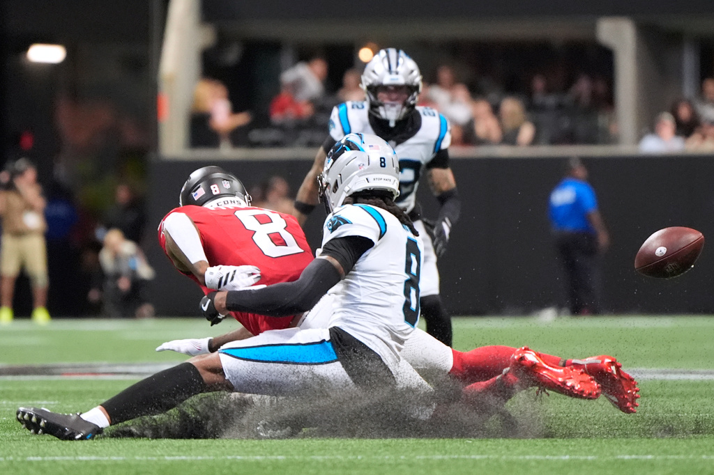 Atlanta Falcons tight end Kyle Pitts (8) drops the ball against Carolina Panthers cornerback Jaycee Horn (8) during an NFL football game in Atlanta, Sunday, Sept. 20, 2026. (AP Photo/Mike Stewart)