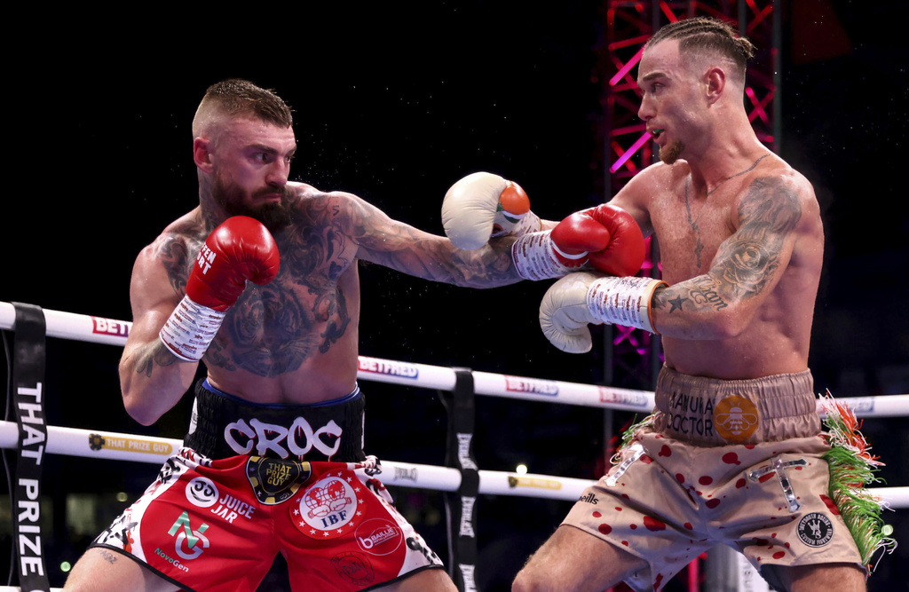 Lewis Crocker, left, and Paddy Donovan battle during an IBF world welterweight bout at the SSE Arena, Saturday, Sept. 13, 2025, in Belfast, Northern Ireland. (Peter Morrison/PA via AP)