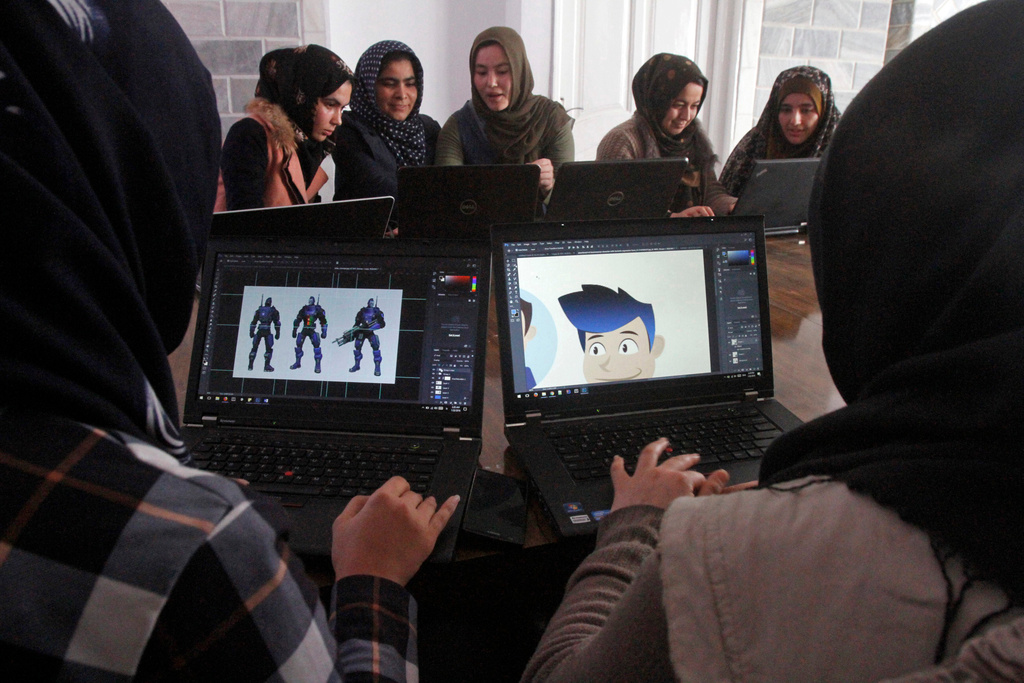 FILE - Afghan coders practice at the Code to Inspire computer training center in Herat province, western Afghanistan, Jan. 22, 2018. (AP Photo/Ahmad Seir, File)