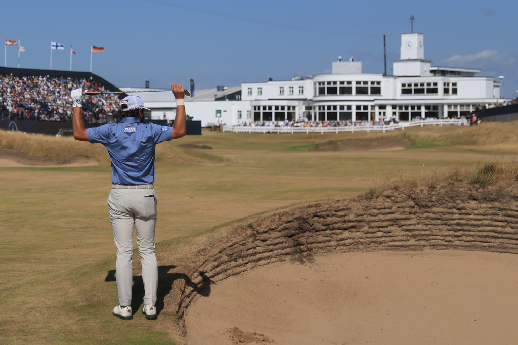 Cameron Young of the United States reacts after he played out of a bunker on the18th hole during the final day of the British Open Golf championships at Royal Birkdale golf club, in Southport, England, Sunday, July 19, 2026. (AP Photo/Peter Morrison)