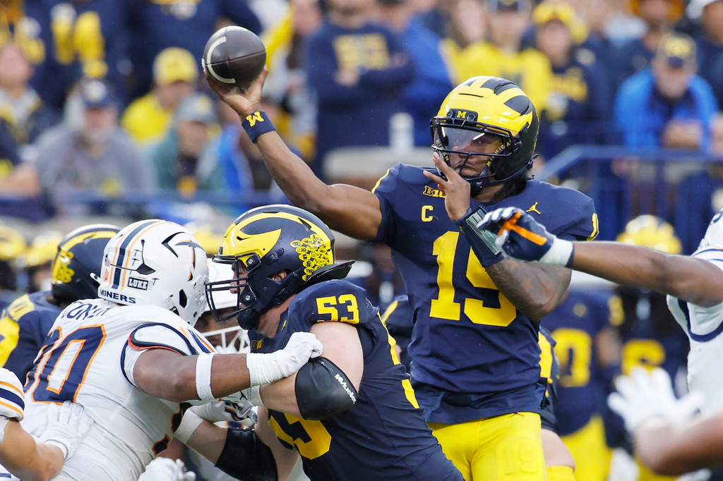 Michigan quarterback Bryce Underwood (19) looks to pass the ball over the offensive line during the second half of an NCAA college football game against UTEP, Saturday, Sept. 19, 2026, in Ann Arbor, Mich. (AP Photo/Duane Burleson)