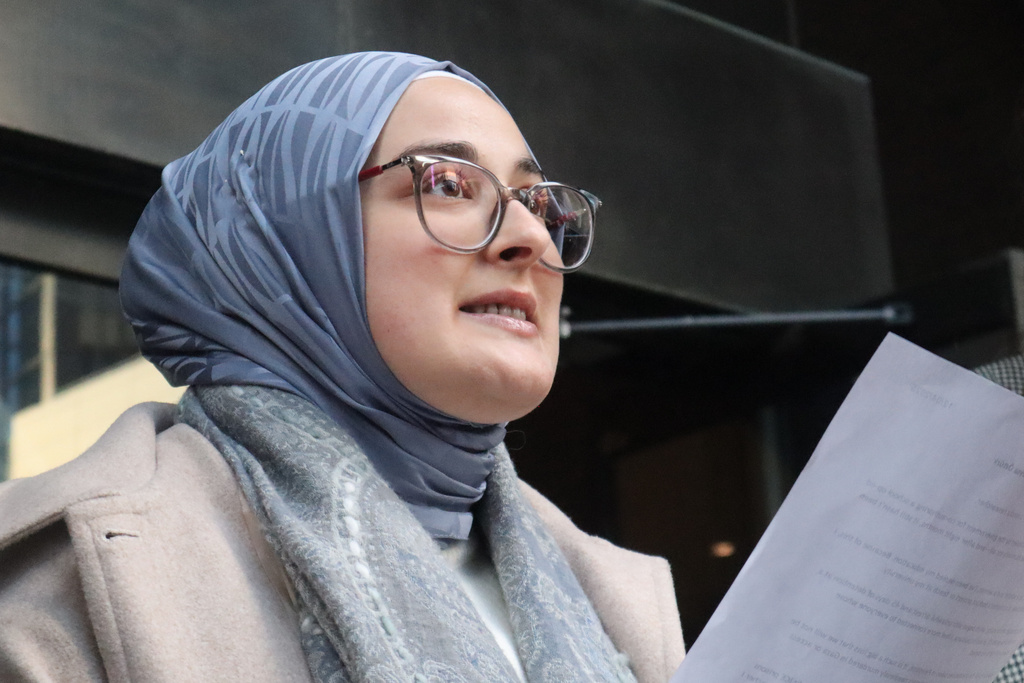 FILE - Tufts University doctoral student Rumeysa Ozturk reads from a prepared statement following a court hearing outside the John Joseph Moakley United States Courthouse, Dec. 4, 2025, in Boston. (AP Photo/Leah Willingham, File)