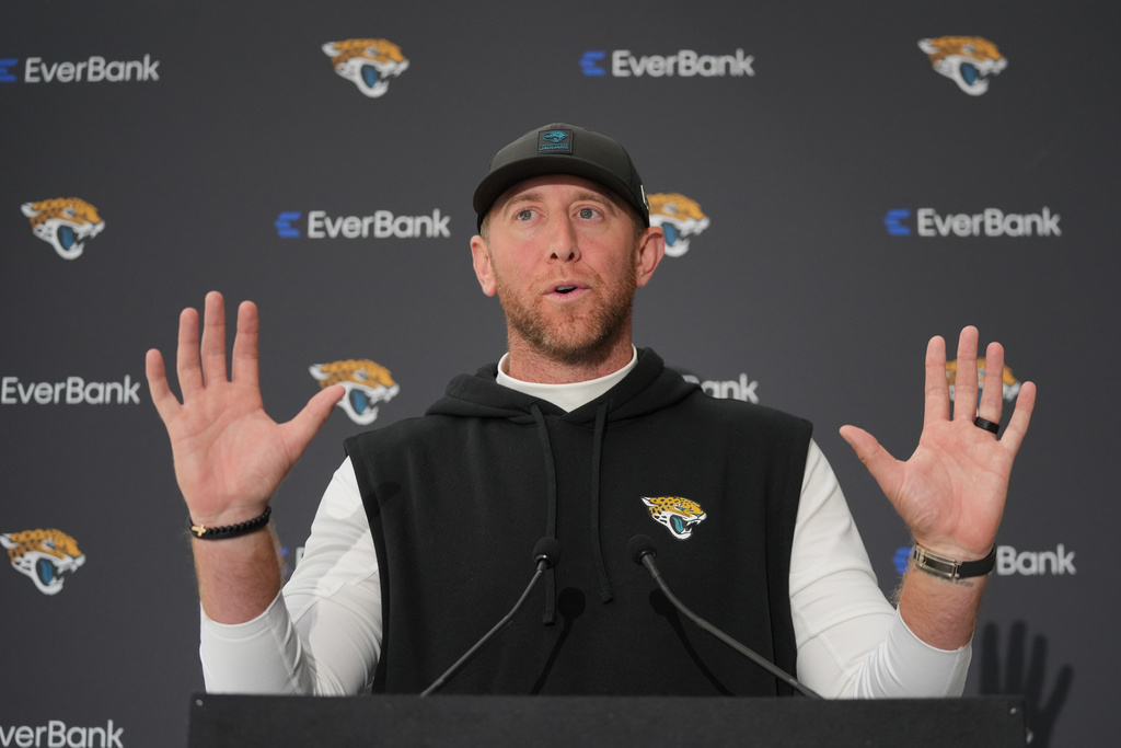 Jacksonville Jaguars head coach Liam Coen speaks during a press conference at an NFL football practice at The Grove in Watford, England, Friday, Oct. 17, 2025. (AP Photo/Kin Cheung)