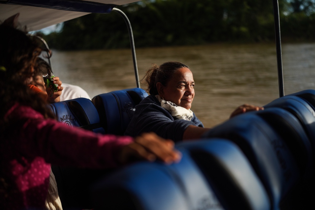 Jani Silva, 63, sails in a boat on the Putumayo River, on the outskirts of Puerto Asis, Colombia, Wednesday, Nov. 26, 2025. (AP Photo/Ivan Valencia)
