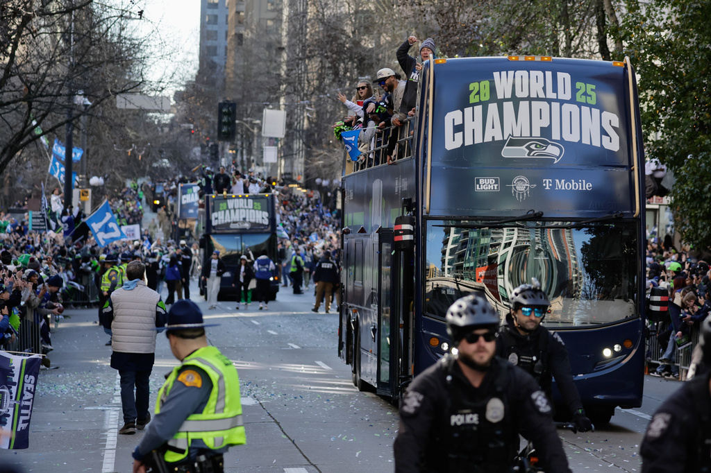 FILE - Seattle Seahawks players take part in the team's NFL football Super Bowl 60 parade and celebration, Wednesday, Feb. 11, 2026, in Seattle. (AP Photo/John Froschauer,File)