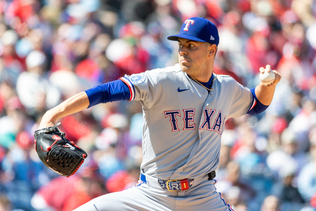 Texas Rangers pitcher MacKenzie Gore throws in the first inning of a baseball game against the Philadelphia Phillies, Sunday, March 29, 2026, in Philadelphia. (AP Photo/Laurence Kesterson)