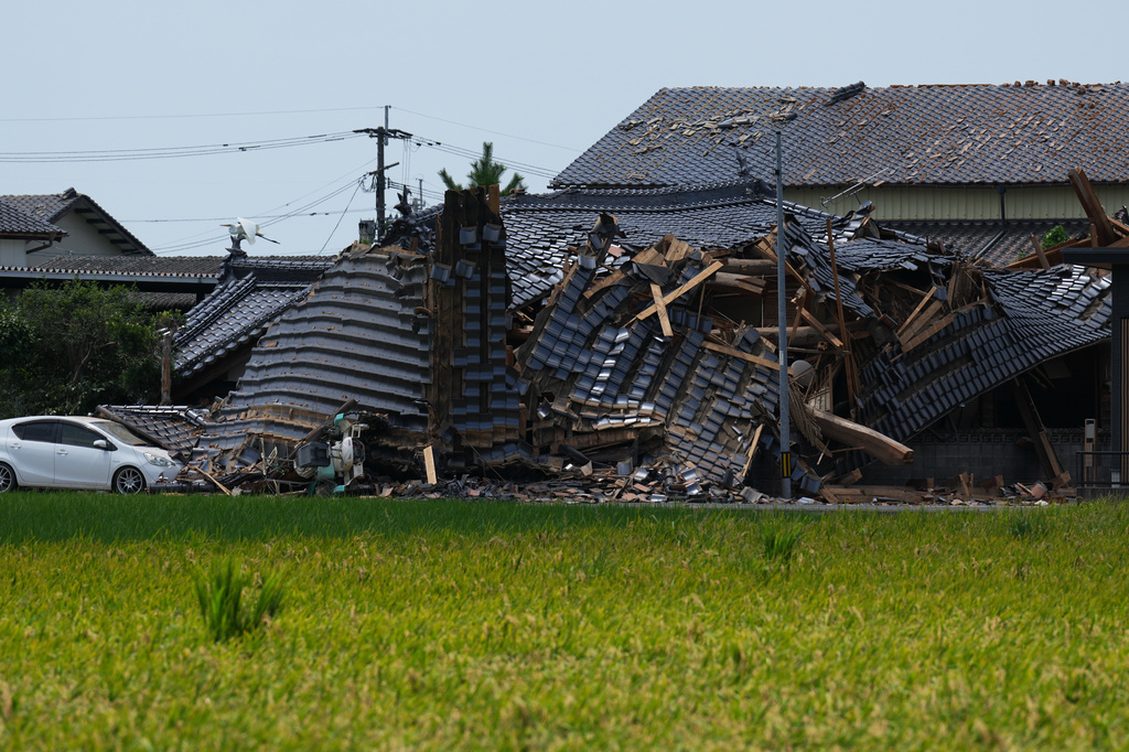 A residential building is seen damaged in Hikawa, southern Japan, Thursday, July 30, 2026, two days after an earthquake hit the area. (AP Photo/Hiro Komae)