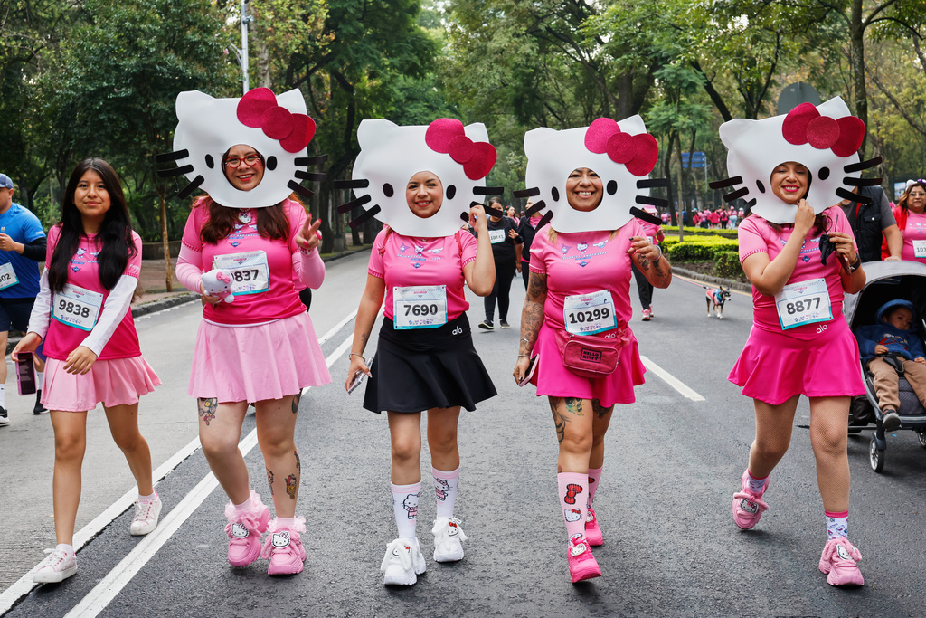 FILE - People dressed as Japanese character Hello Kitty compete in a Hello Kitty-themed race in Mexico City, Sunday, Oct. 5, 2025. (AP Photo/Claudia Rosel, File)