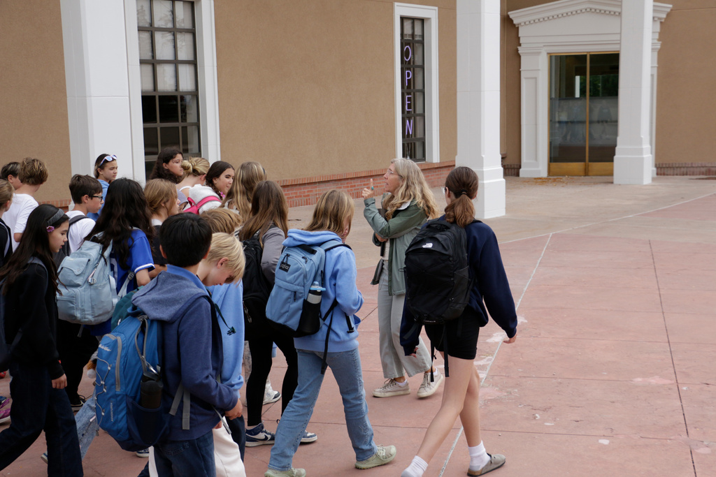 Lisa Nordstrum, a history teacher at Santa Fe Preparatory School, walks with her seventh-grade history class during a field trip outside of the New Mexico State Capitol, Wednesday, Oct. 8, 2025, in Santa Fe, N.M. (AP Photo/Stacy Thacker)