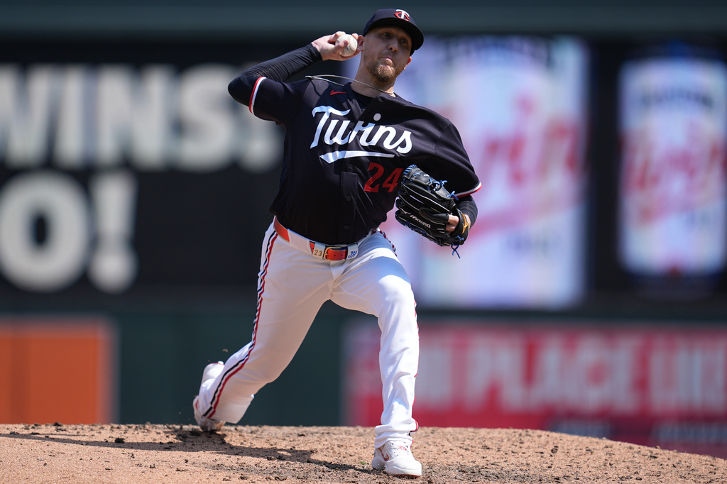 Minnesota Twins relief pitcher Jeff Hoffman (24) delivers during the seventh inning of a baseball game against the Baltimore Orioles Wednesday, Aug. 12, 2026, in Minneapolis. (AP Photo/Abbie Parr)