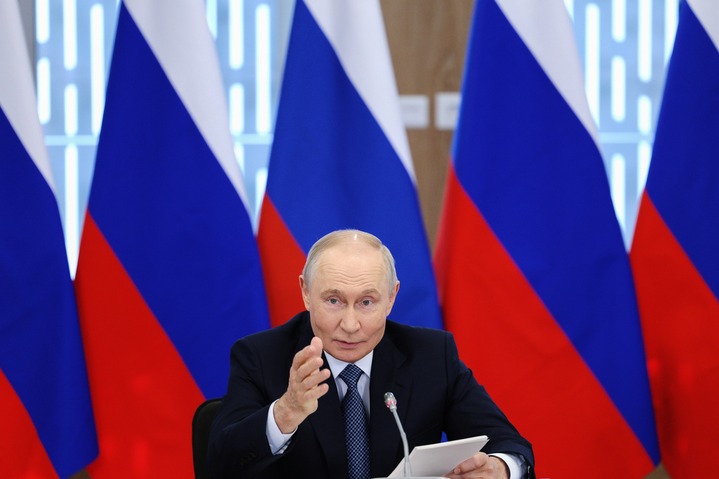 Russian President Vladimir Putin speaks during a meeting at the Siberian Ring Source of Photons synchrotron radiation facility designed for multidisciplinary research in Koltsovo near Novosibirsk, Russia, Tuesday, Aug. 11, 2026. (Gavriil Grigorov, Sputnik, Kremlin Pool Photo via AP)