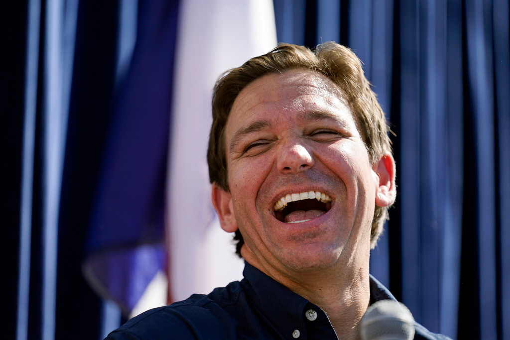 FILE - Republican presidential candidate Florida Gov. Ron DeSantis laughs at the Iowa State Fair, Aug. 12, 2023, in Des Moines, Iowa. (AP Photo/Jeff Roberson, File)