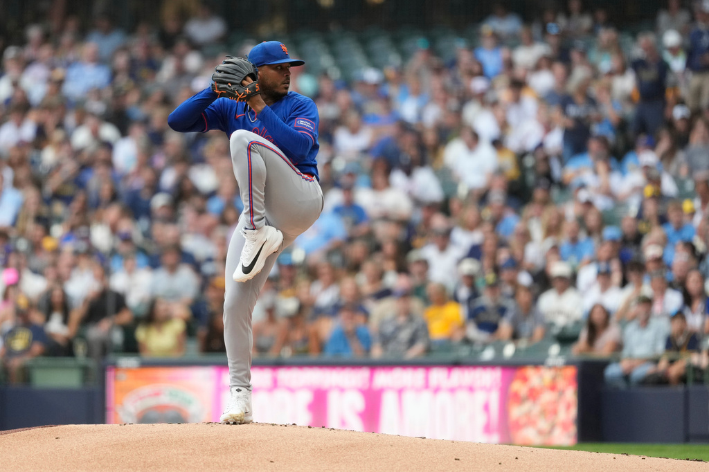 New York Mets pitcher Freddy Peralta winds up to deliver during the first inning of a baseball game against the Milwaukee Brewers, Monday, July 20, 2026, in Milwaukee. (AP Photo/Aaron Gash)