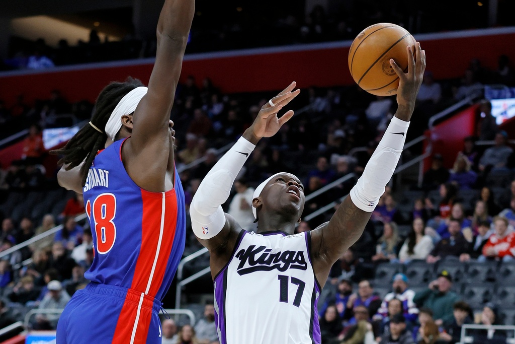 Sacramento Kings guard Dennis Schroder (17) goes to the basket against Detroit Pistons forward Isaiah Stewart (28) during the first half of an NBA basketball game Sunday, Jan. 25, 2026, in Detroit. (AP Photo/Duane Burleson)