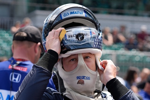 FILE - Marco Andretti puts on his helmet during qualifications for the Indianapolis 500 auto race at Indianapolis Motor Speedway, May 18, 2024, in Indianapolis. (AP Photo/Darron Cummings, file) FILE - Marco Andretti puts on his helmet during qualifications for the Indianapolis 500 auto race at Indianapolis Motor Speedway, May 18, 2024, in Indianapolis. (AP Photo/Darron Cummings, file)