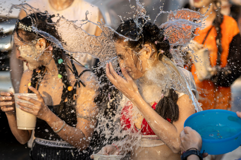 People participate in the Songkran water festival to celebrate the Thai New Year in Prachinburi province, Thailand, Monday, April 13, 2026. (AP Photo/Wason Wanichakorn)