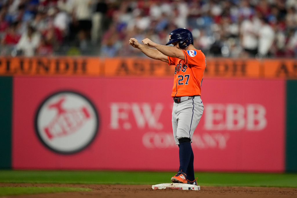 Houston Astros' Jose Altuve celebrates after hitting a double against Philadelphia Phillies pitcher Cristopher Sánchez for his 2,500th career hit during the third inning of a baseball game Wednesday, Sept. 9, 2026, in Philadelphia. (AP Photo/Matt Slocum)