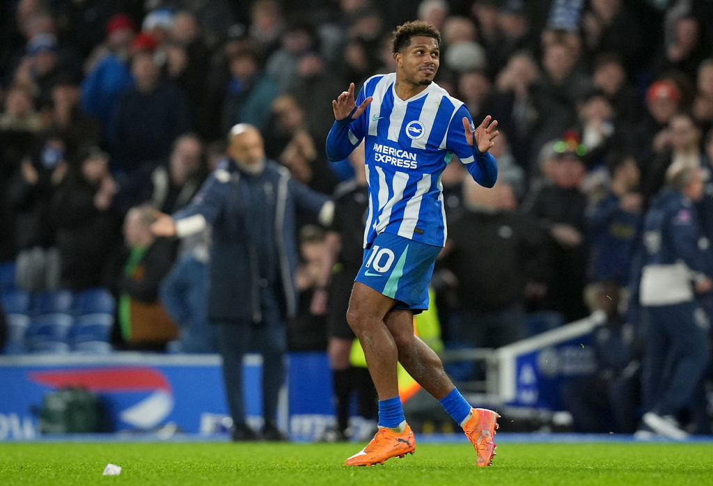 Brighton and Hove Albion's Georginio Rutter celebrates after scoring his sides first goal during the English Premier League soccer match between Brighton and Hove Albion v West Ham United, in Brighton, England, Sunday, Dec. 7, 2025. (Gareth Fuller/PA via AP)